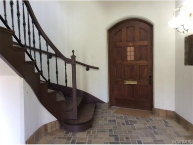 The Entrance Foyer has a lovely curved staircase. 