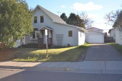 View of front of property with a garage and a fron