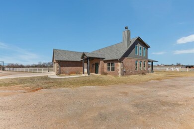 View of home's exterior featuring brick siding, fe