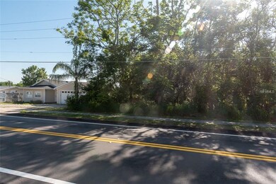 Property is in front and to the right ... has sidewalk in front.