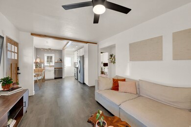 Living room with healthy amount of natural light and wood finished floors