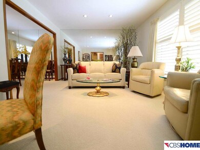 Very large and comfortable loving room. Large windows, covered by plantation shutters look out on to the beautiful yard and quiet (not through) street.