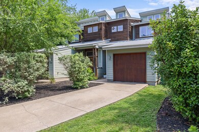Contemporary home featuring concrete driveway, me
