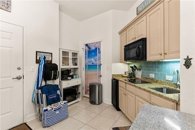 Kitchenette with beverage cooler and appliances