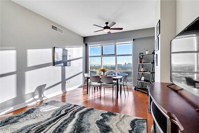 Dining space featuring wood finished floors, a cei