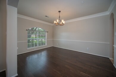 Freshly painted dining space with large front window and updated lighting connects to the kitchen for easy entertaining.