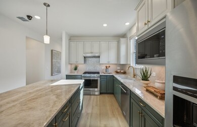 Eat in kitchen features large island *Model representation
