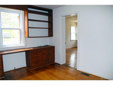 Bedroom with built in bookshelves.  Could also be 