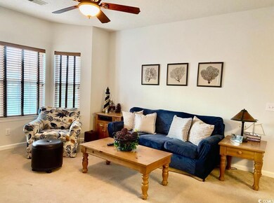 Living room featuring carpet flooring, a ceiling f