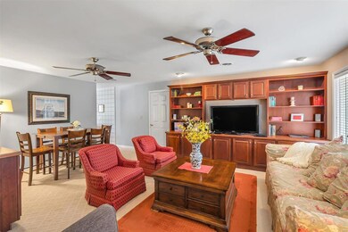 Large AND cozy living room with beautiful built-in bookshelves!