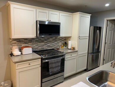 Kitchen featuring stainless steel appliances, a s