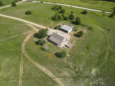 Main house with garage at front of the property.
