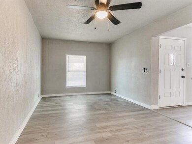 Empty room with ceiling fan, light hardwood / wood