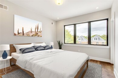 Image is virtually staged. The master bedroom is g