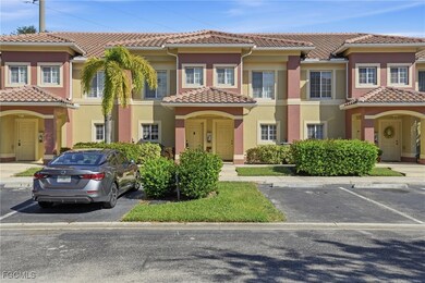 Mediterranean / spanish house featuring stucco siding, uncovered parking, and a tile roof