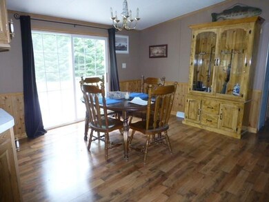Dining room with sliders to large deck