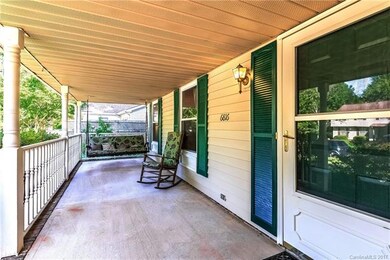 Huge Country Front Porch with a relaxing Porch Swi