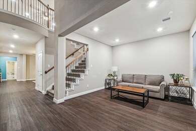 The entrance has an inviting formal living area, a