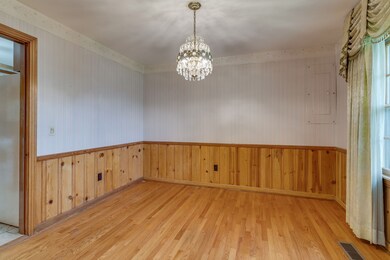  Formal dining with real pine tongue and groove paneling and wood floors.