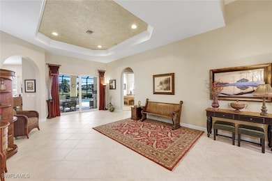 The primary suite is located through the door to the right of the lanai opening.