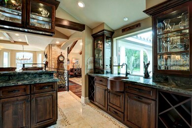 Also in the wet bar area, is a beautiful apron front copper sink and a large window that allows a perfect view of the​​‌​​​​‌​​‌‌​​​‌​​‌‌​‌‌‌​​‌‌​‌‌‌​‌​​​‌‌​ backyard.