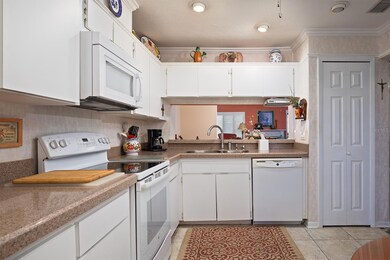 kitchen 2 overlooks the dining and living rooms