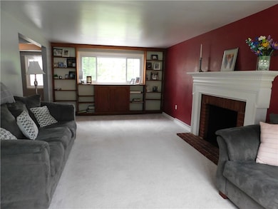Spacious Living Room with built in bookshelves.
