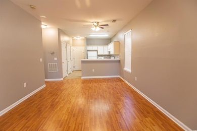 Unfurnished living room with baseboards, a ceiling