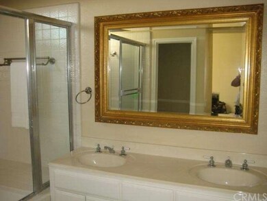 Dual vanity master bath with large roman tub and s