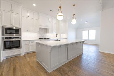 Kitchen with visible vents, backsplash, stainless 