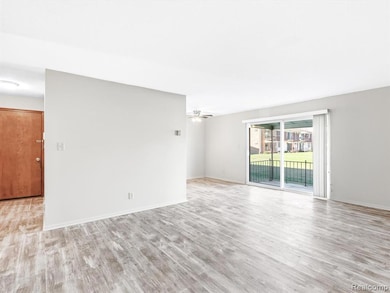Spare room featuring light wood finished floors and ceiling fan