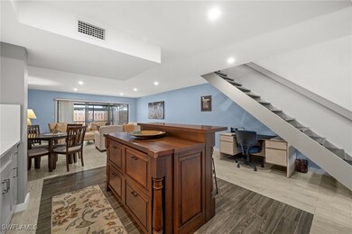 Office with recessed lighting and dark wood-style