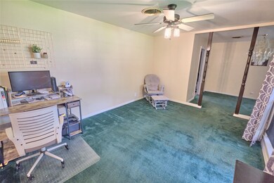 Enter in to what could be a home office of second living space.