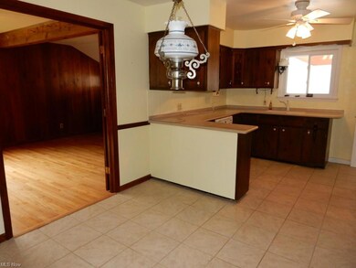 Eat-In Kitchen With Tile Floors and Corian Counter