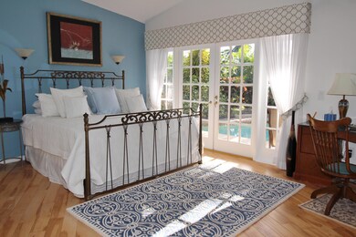 Master_Bedrm_w_French_Doors_to_Pool