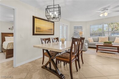 Dining room with light tile patterned floors, base