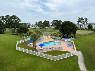 View of pool featuring a patio and a lawn