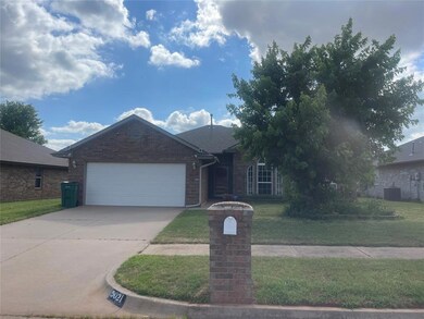 View of front facade with a garage and a front yar