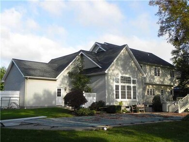 Exterior Back fenced property with multi-tiered de