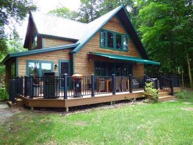 View of waterfront end of house. Spacious trex dec