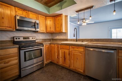 Kitchen featuring sink, hanging light fixtures, ce