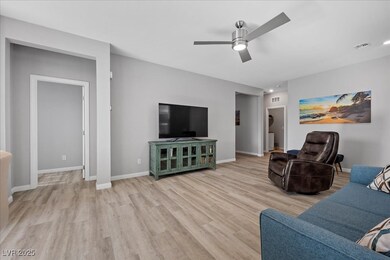 Living room featuring light wood-style flooring, c