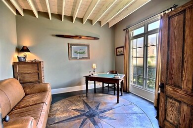 Office with scored concrete floors and a compass r