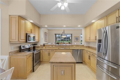Kitchen featuring kitchen peninsula, sink, a cente