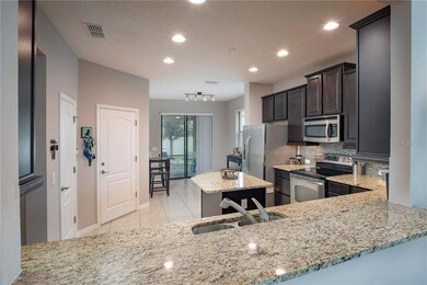 Beautiful kitchen features expansive pass through 