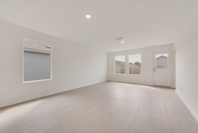 Spare room with light wood-type flooring and recessed lighting