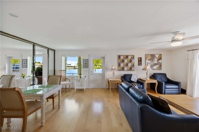 Living room featuring healthy amount of natural light, light wood-style floors, and a ceiling fan