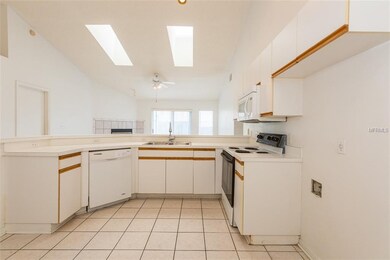 Love the Skylights! Kitchen through to family room