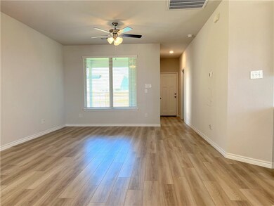 Spare room featuring baseboards, light wood-style