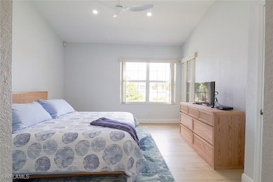 Bedroom with light hardwood / wood-style flooring